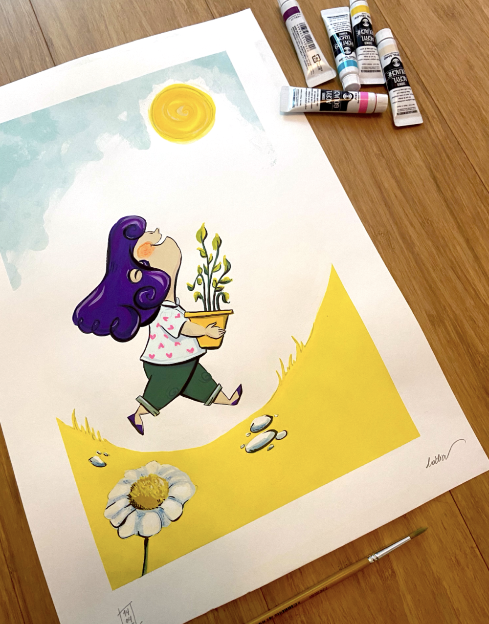 Photo with Nadia Ferreira illustration of girl with purple hair with flower pot looking at yellow sun. Tubes of gouache on the right side.